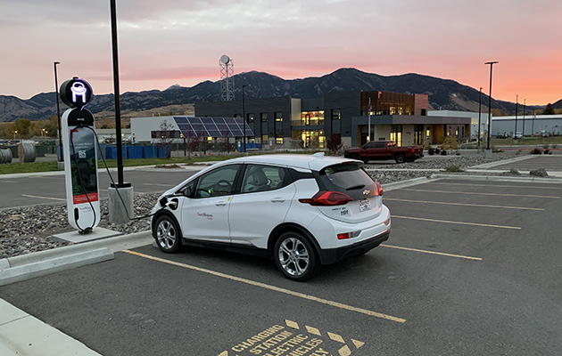 An Electric Vehicle charges outside the Bozeman NorthWestern Energy office.